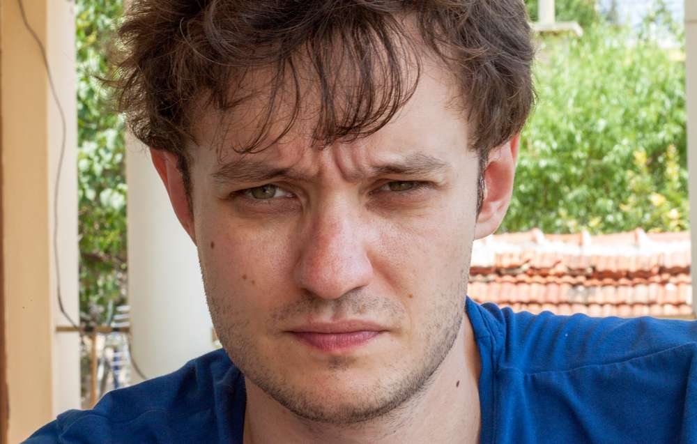 Dishevelled Andrey Kiryushkin after a hangover, or perhaps a quick fix
