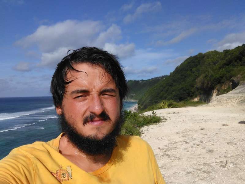 Arseniy Shestakov, all beard and tanned on a deserted Asian beach